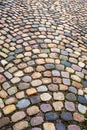 Colorful cobblestone pattern on old European cobbled street Royalty Free Stock Photo