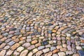 Colorful cobblestone pattern on old European cobbled street