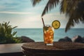 Colorful cocktail or juice in a glass decorated on a wooden table on blurred seascape background