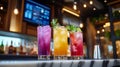 Colorful cocktails on marble bar in modern workspace with natural elements and bright lighting Royalty Free Stock Photo