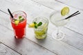 Colorful cocktails set. Mojito , Margarita, red alcohol cocktail on wooden table close up. Royalty Free Stock Photo