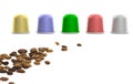 Colorful coffee capsules and coffee beans