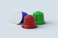 Colorful coffee capsules on gray background. Modern decaf pods for machine.