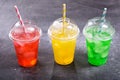 Colorful cold drinks in plastic cups