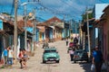 Colorful Colonial Caribbean historic village with cobblestone street, classic car and house, Trinidad, Cuba, America.