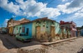 Colorful Caribbean aged village with cobblestone street, classic car and Colonial architecture, Trinidad, Cuba, America. Royalty Free Stock Photo