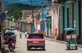 Colorful Colonial Caribbean historic town with cobblestone street, classic car and house, Trinidad, Cuba, America. Royalty Free Stock Photo