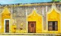 Colorful colonial style buildings at street of Izamal city old town, Mexico Royalty Free Stock Photo