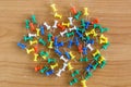 Colorful color push pins Thumbtacks. top view on wood table. Royalty Free Stock Photo