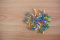 Colorful color push pins Thumbtacks. top view on wood table. Royalty Free Stock Photo