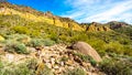 Colorful Colorful Yellow and Orange Geological Layers of Usery Mountain surrounded by Large Boulders, Saguaro and other Cacti