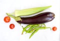 A colorful combination of fruits and vegetables such as eggplant, tomatoes, peppers and okra Royalty Free Stock Photo