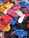 Colorful and comfortable rubber sandals made from rubber for sale at the local market area. Rows of Beautiful Multi-Colored Royalty Free Stock Photo