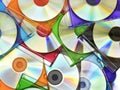 Colorful compact discs in boxes stacked in a pile as background Royalty Free Stock Photo