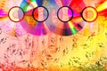 Colorful compact disks on ÃÂ° abstract  background with falling notes Royalty Free Stock Photo