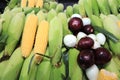 Colorful composition with raw corn, white and red onions Royalty Free Stock Photo