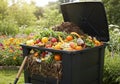 Colorful Compost Bin in a Lush Garden Royalty Free Stock Photo