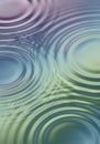 Colorful concentric ripples spread across a liquid surface, creating a visually soothing Royalty Free Stock Photo
