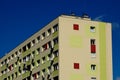 Colorful condominium building elevation detail. Windows and wall installed air-conditioning condensing units