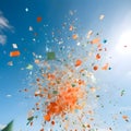 Colorful confetti against the daytime sky. New Year\'s party and celebra