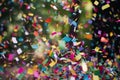 colorful confetti flying through the air, with blurred movement in slow motion