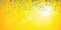 Colorful confetti rain on yellow sunny summer background