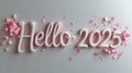 Colorful confetti and the silver words 'hello 2025' on a white background create a festive celebration Royalty Free Stock Photo