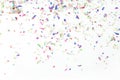 Colorful confetti on white background. Holiday or party background