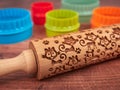 Colorful cookie cutters and embossed rolling pin