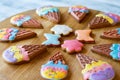 Colorful cookies on wooden board. Royalty Free Stock Photo