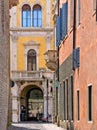 Narrow street with old colorful buildings and architecture with windows and balconyin old part of Padua, padova italy Royalty Free Stock Photo