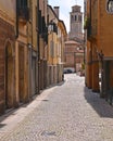 Narrow street with old colorful buildings and architecture with windows and balconyin old part of Padua, padova italy Royalty Free Stock Photo
