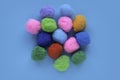 Colorful cotton balls on blue background Royalty Free Stock Photo