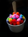 Colorful cotton balls in glasses Royalty Free Stock Photo