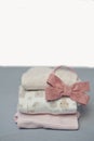 Colorful cotton folded clothes stack on white table empty space background,baby laundry. Royalty Free Stock Photo