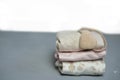 Colorful cotton folded clothes stack on white table empty space background,baby laundry. Royalty Free Stock Photo