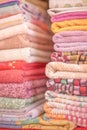 Colorful cotton towels neatly folded on shelf Royalty Free Stock Photo