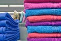 Towels neatly folded on shelf display in hypermarket Royalty Free Stock Photo