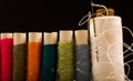 Colorful cotton yarns on rolls for sewing. Thread spools used in fabric and textile industry Royalty Free Stock Photo