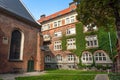 Colorful courtyard of 15th century Sankt Peders church with brick walls in Copenhagen, Denmark.