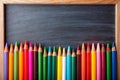 Colorful Crayons on Blackboard Royalty Free Stock Photo