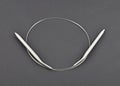 Circular knitting needle on black background