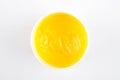 Conainer with yellow balm on white background Royalty Free Stock Photo