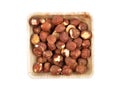 Hazelnuts in bamboo bowl isolated