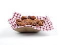 Hazelnuts on cloth in bamboo bowl