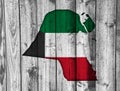 Map and flag of Kuwait on weathered wood Royalty Free Stock Photo