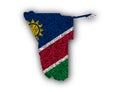Map and flag of Namibia on poppy seeds