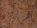 Map of Texas on rusty metal