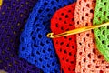 Colorful crochet hooks and granny squares Royalty Free Stock Photo