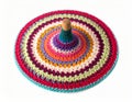 Colorful Crochet Spinning Top Toy with Spiral Pattern on White Background Royalty Free Stock Photo
